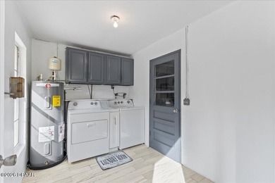 COASTAL LIVING with CHARACTER... Where MORNINGS START ON THE on Palm Harbor Golf Club in Florida - for sale on GolfHomes.com, golf home, golf lot