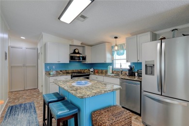 Well-maintained 2-bedroom, 2 bath home in the desirable Barefoot on Barefoot Bay Golf Course in Florida - for sale on GolfHomes.com, golf home, golf lot
