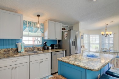 Well-maintained 2-bedroom, 2 bath home in the desirable Barefoot on Barefoot Bay Golf Course in Florida - for sale on GolfHomes.com, golf home, golf lot