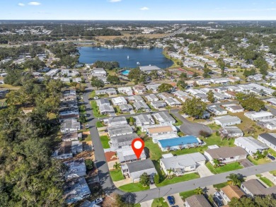 This high end Manufactured home on an Ultimately landscaped on Water Oak Country Club Estates in Florida - for sale on GolfHomes.com, golf home, golf lot