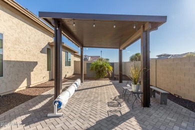 This Nearly NEW home features an amazing backyard with multiple on Tuscany Falls At Pebble Creek in Arizona - for sale on GolfHomes.com, golf home, golf lot