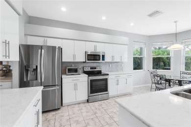 Wake up to breathtaking sunrises over the water from the comfort on University Park Country Club in Florida - for sale on GolfHomes.com, golf home, golf lot