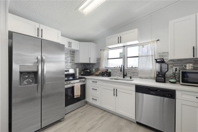 Step into modern comfort with this remodeled 1986 home situated on Maple Leaf Golf and Country Club in Florida - for sale on GolfHomes.com, golf home, golf lot