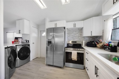 Step into modern comfort with this remodeled 1986 home situated on Maple Leaf Golf and Country Club in Florida - for sale on GolfHomes.com, golf home, golf lot