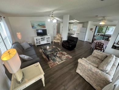 This well-cared for home is located only steps from one of the on Del Tura Golf and Country Club in Florida - for sale on GolfHomes.com, golf home, golf lot