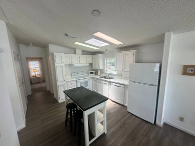 This well-cared for home is located only steps from one of the on Del Tura Golf and Country Club in Florida - for sale on GolfHomes.com, golf home, golf lot