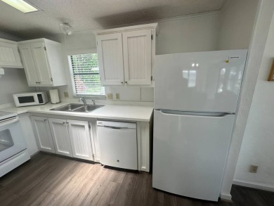 This well-cared for home is located only steps from one of the on Del Tura Golf and Country Club in Florida - for sale on GolfHomes.com, golf home, golf lot