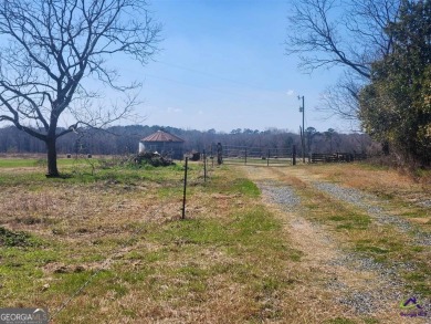 This exceptional property offers a prime location in the heart on Woods Golf Course in Georgia - for sale on GolfHomes.com, golf home, golf lot