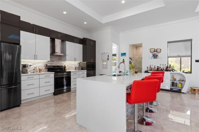 Exquisite modern contemporary 4 Bedroom 3 bath pool home in on Royal Tee Country Club in Florida - for sale on GolfHomes.com, golf home, golf lot