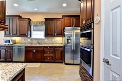 A truly coveted *Christopher Wren* model overlooking the fairway on Colonial Heritage Golf Club in Virginia - for sale on GolfHomes.com, golf home, golf lot