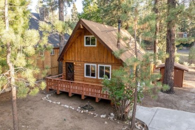Enveloped by a quiet grove of mature pines and backing to a on Big Bear Mountain Ski and Golf Resort in California - for sale on GolfHomes.com, golf home, golf lot