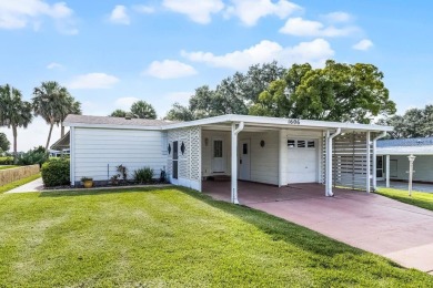 Enjoy golf course views from this well-maintained 2-bedroom on Orange Blossom Hills Golf and Country Club in Florida - for sale on GolfHomes.com, golf home, golf lot