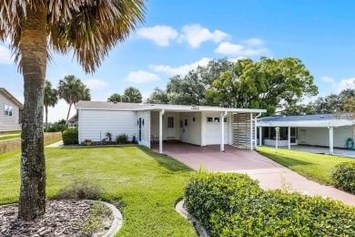 Enjoy golf course views from this well-maintained 2-bedroom on Orange Blossom Hills Golf and Country Club in Florida - for sale on GolfHomes.com, golf home, golf lot