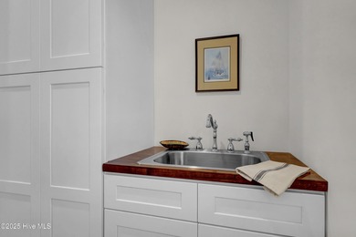 A timeless classic residence offering exceptional craftsmanship on Country Club of Landfall in North Carolina - for sale on GolfHomes.com, golf home, golf lot