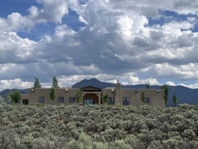 Situated on 6.77 acres spanning three independent parcels (two on Taos Country Club in New Mexico - for sale on GolfHomes.com, golf home, golf lot