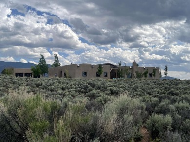 Situated on 6.77 acres spanning three independent parcels (two on Taos Country Club in New Mexico - for sale on GolfHomes.com, golf home, golf lot