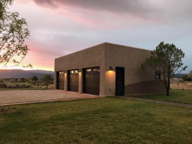 Situated on 6.77 acres spanning three independent parcels (two on Taos Country Club in New Mexico - for sale on GolfHomes.com, golf home, golf lot