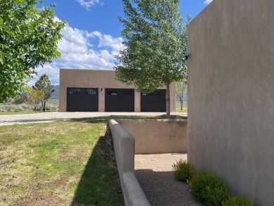 Situated on 6.77 acres spanning three independent parcels (two on Taos Country Club in New Mexico - for sale on GolfHomes.com, golf home, golf lot