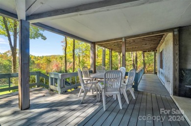 Remarkable golf course and mountain views from this immaculately on Lake Toxaway Country Club in North Carolina - for sale on GolfHomes.com, golf home, golf lot