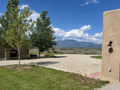 Situated on 6.77 acres spanning three independent parcels (two on Taos Country Club in New Mexico - for sale on GolfHomes.com, golf home, golf lot