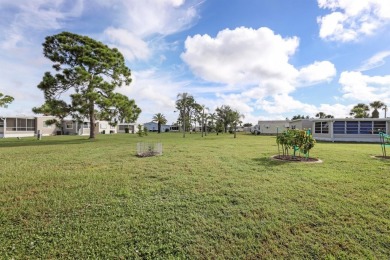 Sassy and charming 2 bedroom, 2 full bath home in award-winning on Maple Leaf Golf and Country Club in Florida - for sale on GolfHomes.com, golf home, golf lot