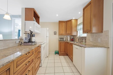 Sassy and charming 2 bedroom, 2 full bath home in award-winning on Maple Leaf Golf and Country Club in Florida - for sale on GolfHomes.com, golf home, golf lot