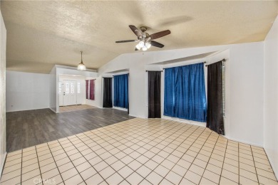 Welcome to 12411 Spring Valley Parkway, located in the highly on Spring Valley Lake Country Club in California - for sale on GolfHomes.com, golf home, golf lot