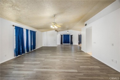 Welcome to 12411 Spring Valley Parkway, located in the highly on Spring Valley Lake Country Club in California - for sale on GolfHomes.com, golf home, golf lot