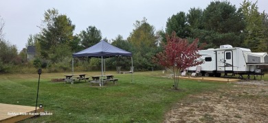 Your Perfect Up North Escape Awaits!  Discover this amazing on Lakeside Golf Course in Michigan - for sale on GolfHomes.com, golf home, golf lot