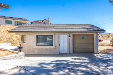 Welcome to 12411 Spring Valley Parkway, located in the highly on Spring Valley Lake Country Club in California - for sale on GolfHomes.com, golf home, golf lot