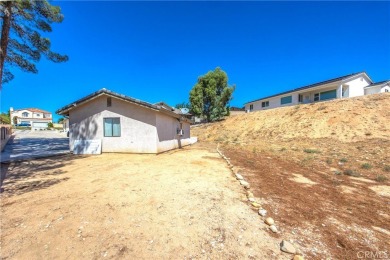 Welcome to 12411 Spring Valley Parkway, located in the highly on Spring Valley Lake Country Club in California - for sale on GolfHomes.com, golf home, golf lot