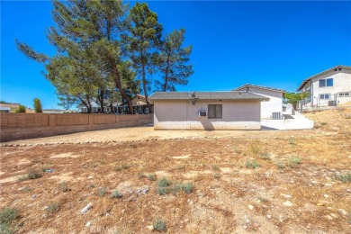Welcome to 12411 Spring Valley Parkway, located in the highly on Spring Valley Lake Country Club in California - for sale on GolfHomes.com, golf home, golf lot