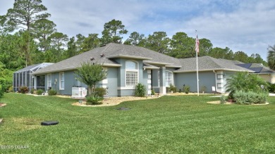 This stunning 4-bedroom saltwater pool home offers both elegance on Plantation Bay Golf and Country Club in Florida - for sale on GolfHomes.com, golf home, golf lot