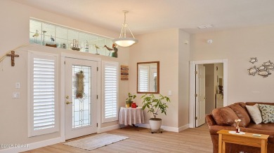 This stunning 4-bedroom saltwater pool home offers both elegance on Plantation Bay Golf and Country Club in Florida - for sale on GolfHomes.com, golf home, golf lot