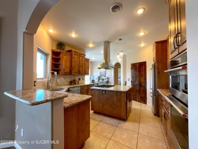 Luxury can become a habit in this elegant Earth & Stone custom on San Juan Country Club in New Mexico - for sale on GolfHomes.com, golf home, golf lot