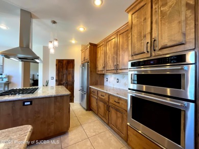 Luxury can become a habit in this elegant Earth & Stone custom on San Juan Country Club in New Mexico - for sale on GolfHomes.com, golf home, golf lot