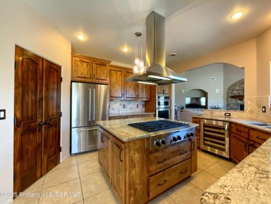 Luxury can become a habit in this elegant Earth & Stone custom on San Juan Country Club in New Mexico - for sale on GolfHomes.com, golf home, golf lot
