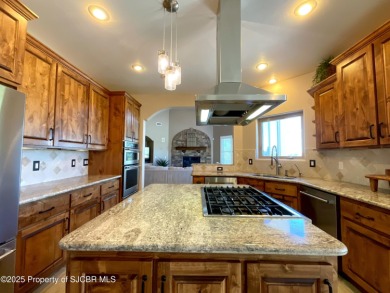 Luxury can become a habit in this elegant Earth & Stone custom on San Juan Country Club in New Mexico - for sale on GolfHomes.com, golf home, golf lot