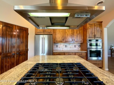 Luxury can become a habit in this elegant Earth & Stone custom on San Juan Country Club in New Mexico - for sale on GolfHomes.com, golf home, golf lot