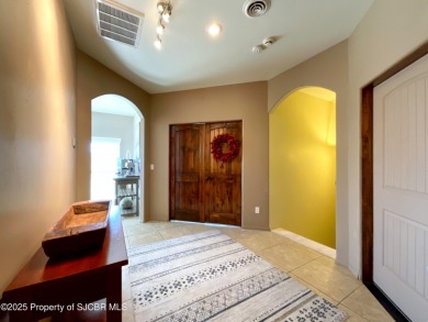 Luxury can become a habit in this elegant Earth & Stone custom on San Juan Country Club in New Mexico - for sale on GolfHomes.com, golf home, golf lot
