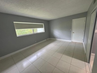 2/2 CONDOMINIUM FOR SALE IN DESIRABLE VERY ACTIVE COMMUNITY AT on Oriole Golf and Tennis Club in Florida - for sale on GolfHomes.com, golf home, golf lot