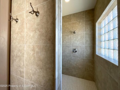 Luxury can become a habit in this elegant Earth & Stone custom on San Juan Country Club in New Mexico - for sale on GolfHomes.com, golf home, golf lot