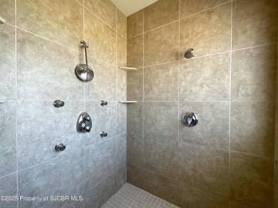 Luxury can become a habit in this elegant Earth & Stone custom on San Juan Country Club in New Mexico - for sale on GolfHomes.com, golf home, golf lot