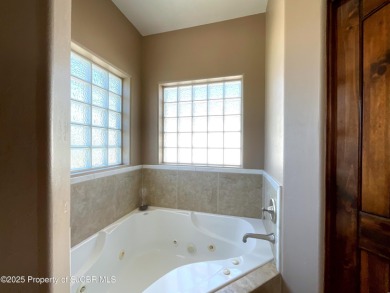 Luxury can become a habit in this elegant Earth & Stone custom on San Juan Country Club in New Mexico - for sale on GolfHomes.com, golf home, golf lot