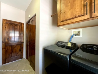 Luxury can become a habit in this elegant Earth & Stone custom on San Juan Country Club in New Mexico - for sale on GolfHomes.com, golf home, golf lot