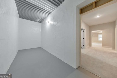 Nestled on 1.67 acres in The Overlook at Marietta Country Club on Marietta Country Club in Georgia - for sale on GolfHomes.com, golf home, golf lot