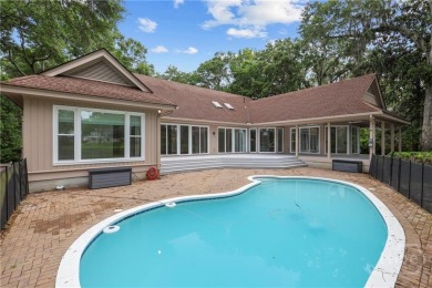 This beautifully updated home in The Landings offers privacy on The Landings Club - Palmetto in Georgia - for sale on GolfHomes.com, golf home, golf lot