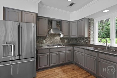 This beautifully updated home in The Landings offers privacy on The Landings Club - Palmetto in Georgia - for sale on GolfHomes.com, golf home, golf lot