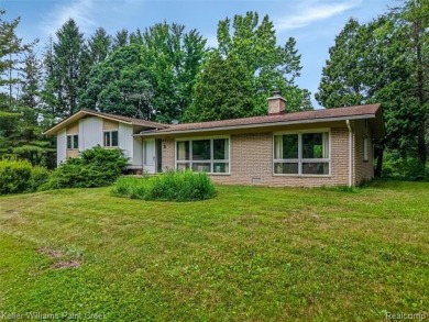 Step into this one-of-a-kind mid-century modern home tucked away on Kensington Metropark Golf Course in Michigan - for sale on GolfHomes.com, golf home, golf lot