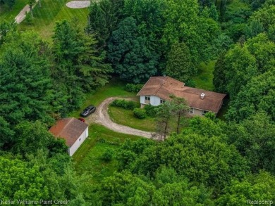 Step into this one-of-a-kind mid-century modern home tucked away on Kensington Metropark Golf Course in Michigan - for sale on GolfHomes.com, golf home, golf lot